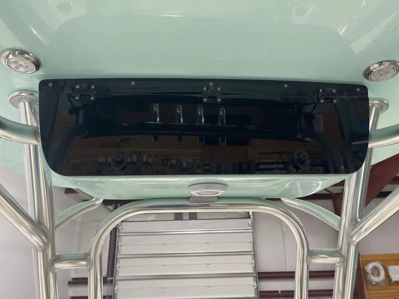 Slide: The Image of 2024 Key West 244CC boat console with stainless steel frame and black windshield. - 32