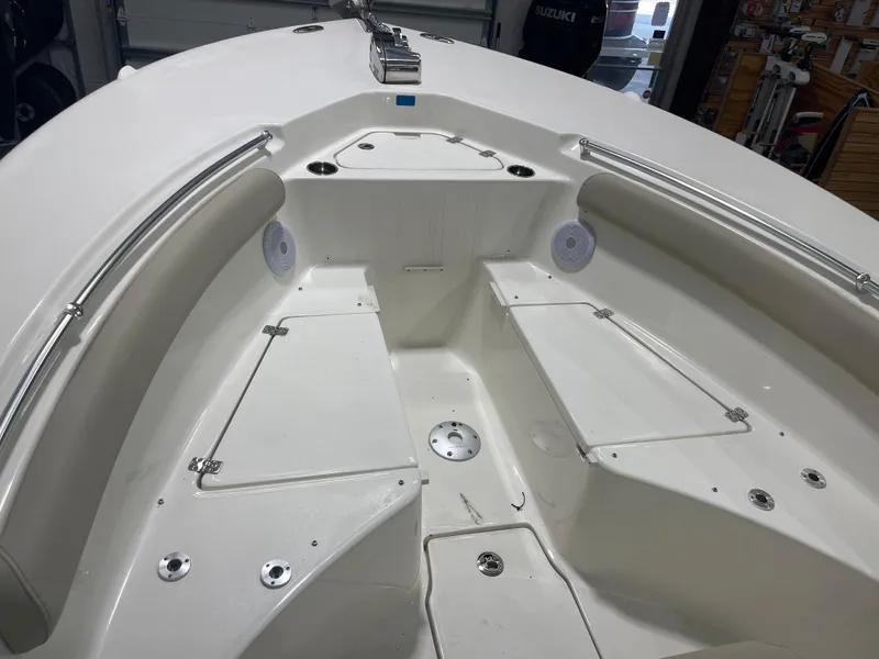 Slide: The Image of 2024 Key West 244CC boat interior with seating and storage compartments. - 34