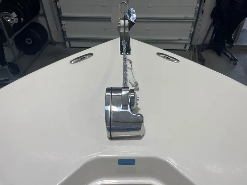 Slide: The Image of 2024 Key West 244CC boat anchor system in a garage setting. - 35