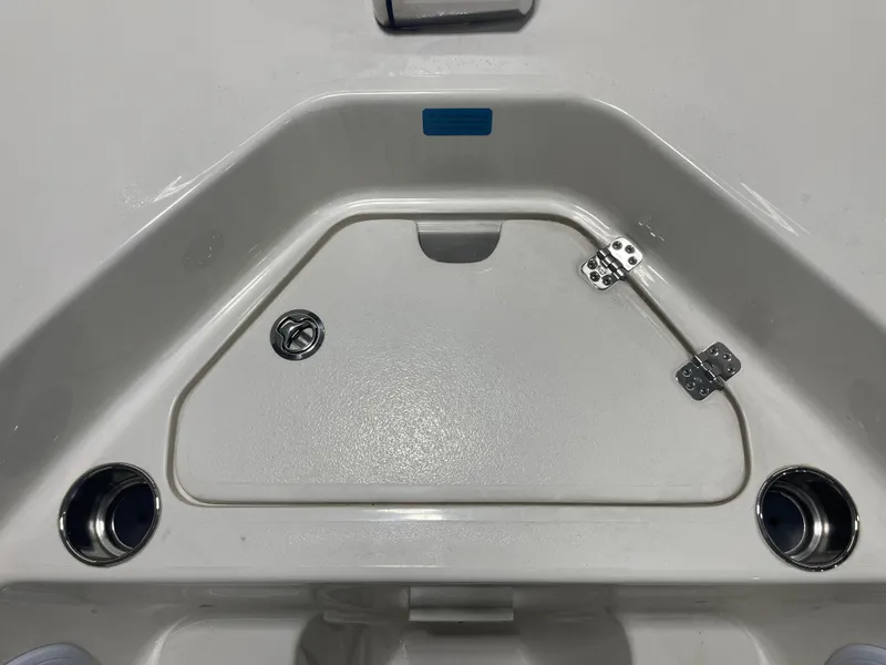 Slide: The Image of 2024 Key West 244CC boat deck with storage compartment and cup holders. - 36