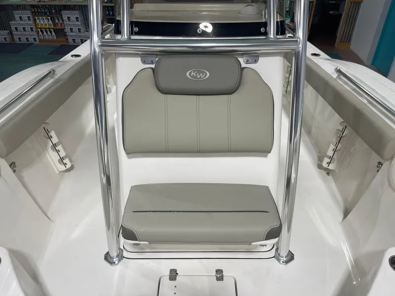 Slide: The Image of 2024 Key West 244CC boat interior with gray seating and chrome accents. - 37