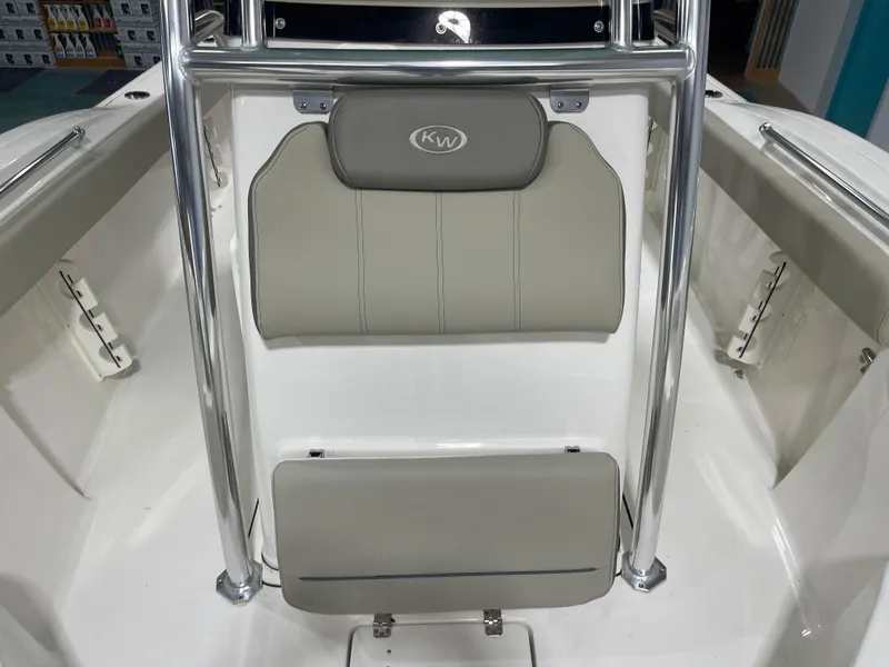 Slide: The Image of 2024 Key West 244CC boat interior with cushioned seating and stainless steel frame. - 39