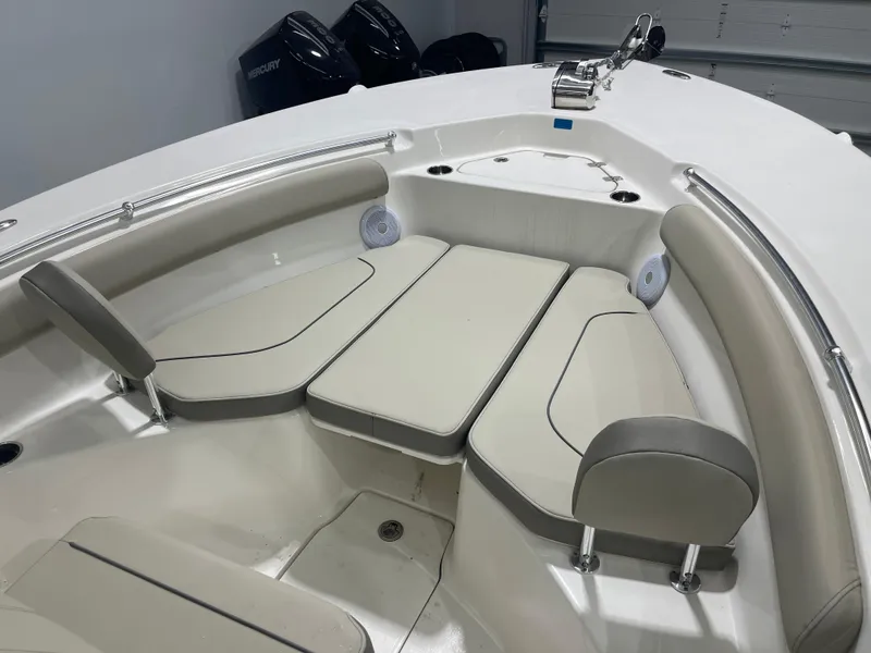 Slide: The Image of 2024 Key West 244CC boat interior with cushioned seating and Mercury engines. - 41