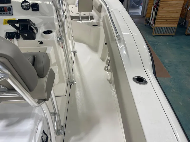 Slide: The Image of 2024 Key West 244CC boat interior with seating and control panel. - 44