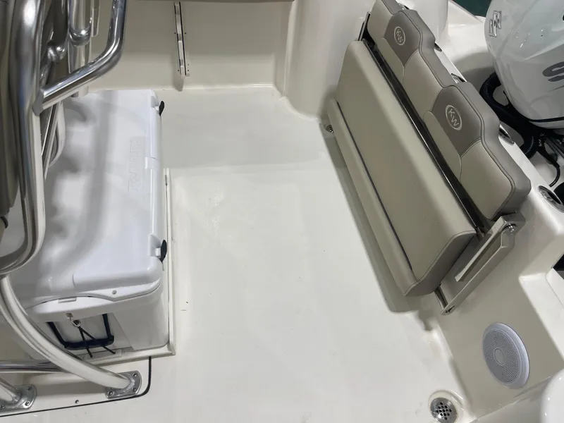 Slide: The Image of 2024 Key West 244CC boat interior with seating and cooler. - 48