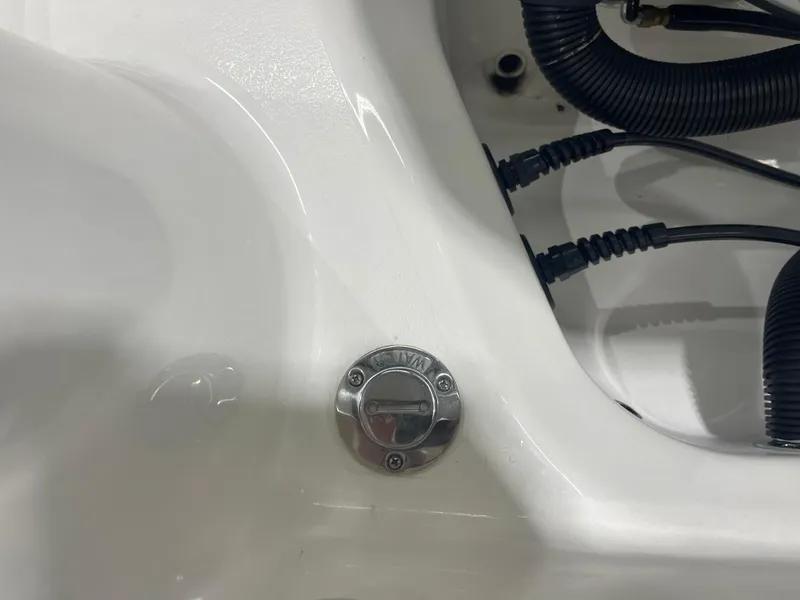 Slide: The Image of 2024 Key West 244CC boat detail showing wiring and a metal cap. - 49