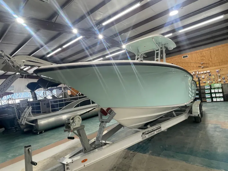 Slide: The Image of 2024 Key West 244CC boat on trailer in showroom. - 5