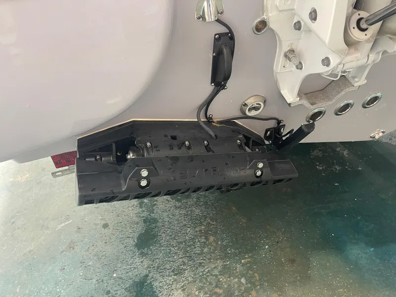 Slide: The Image of 2024 Key West 291FS boat transom with trim tab and wiring. - 10