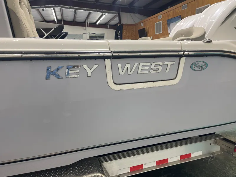 Slide: The Image of 2024 Key West 291FS boat side view in showroom. - 14