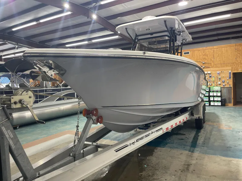 Slide: The Image of 2024 Key West 291FS boat on trailer in indoor showroom. - 16