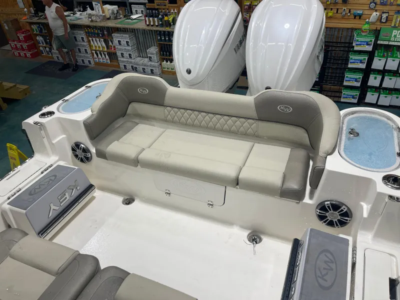 Slide: The Image of 2024 Key West 291FS boat interior with seating and dual engines. - 20