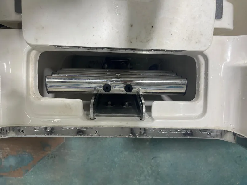 Slide: The Image of 2024 Key West 291FS boat detail showing a metal component in a compartment. - 22