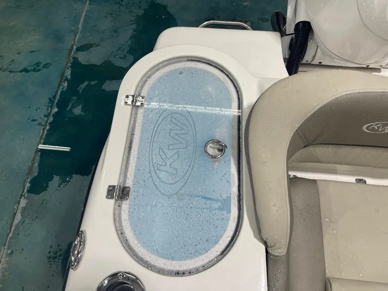 Slide: The Image of 2024 Key West 291FS boat interior with wet seating and KW logo. - 25