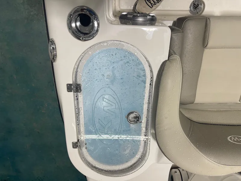 Slide: The Image of 2024 Key West 291FS boat interior with wet seating and storage compartment. - 27