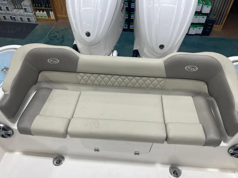 Slide: The Image of 2024 Key West 291FS boat seating with beige upholstery and diamond stitching. - 29