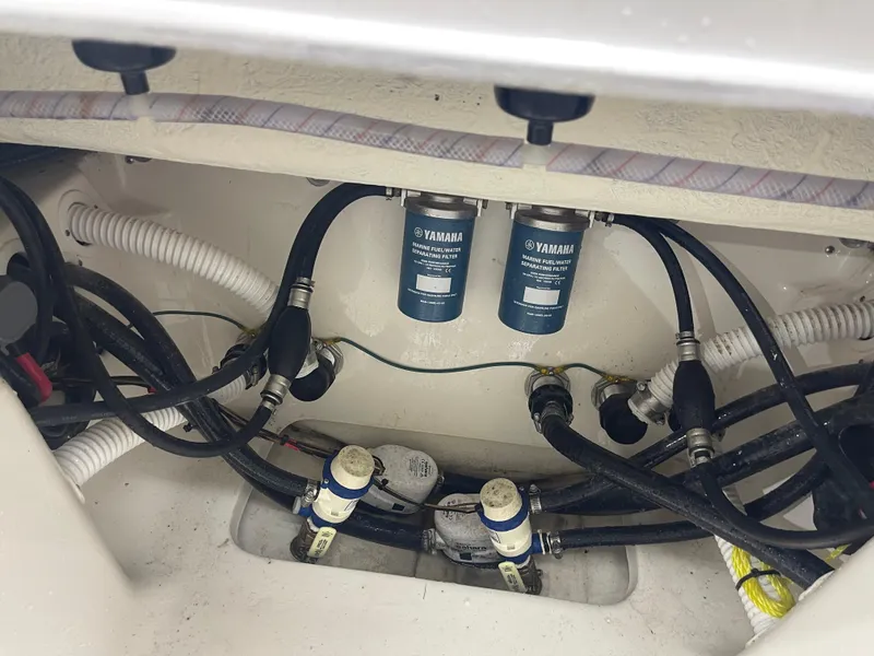 Slide: The Image of 2024 Key West 291FS boat engine compartment with Yamaha marine fuel filters. - 33