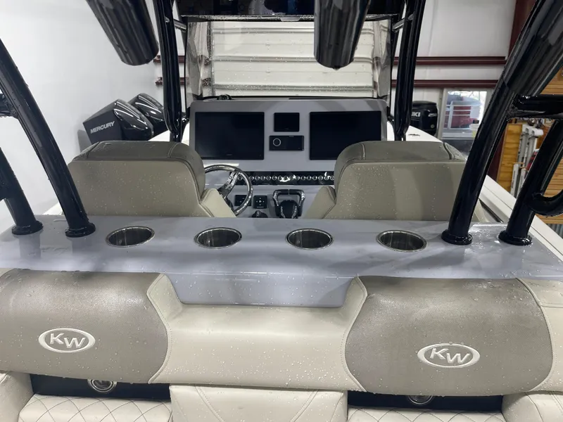 Slide: The Image of 2024 Key West 291FS boat interior with modern dashboard and seating. - 38
