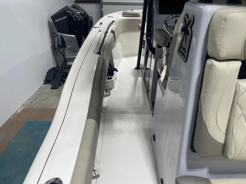Slide: The Image of 2024 Key West 291FS boat interior with Mercury engine, featuring sleek seating and modern design. - 40