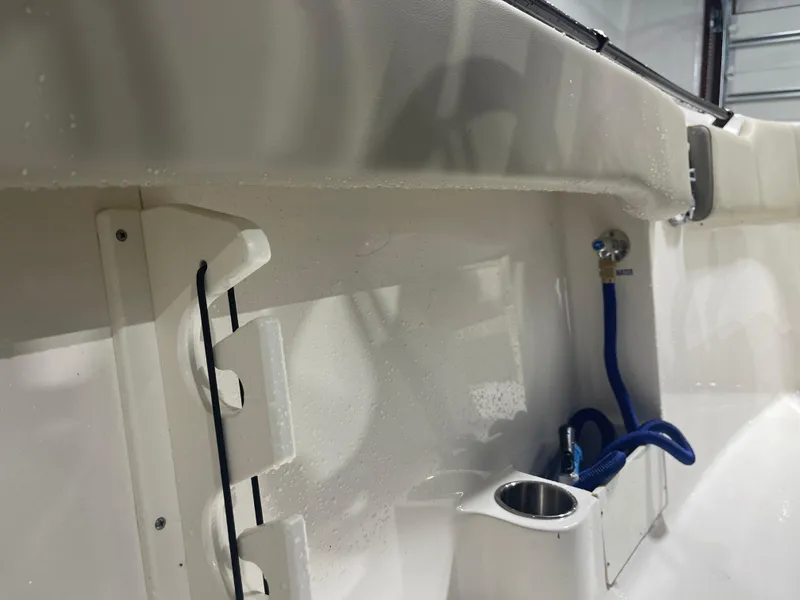 Slide: The Image of 2024 Key West 291FS boat interior with hose and cup holder. - 42