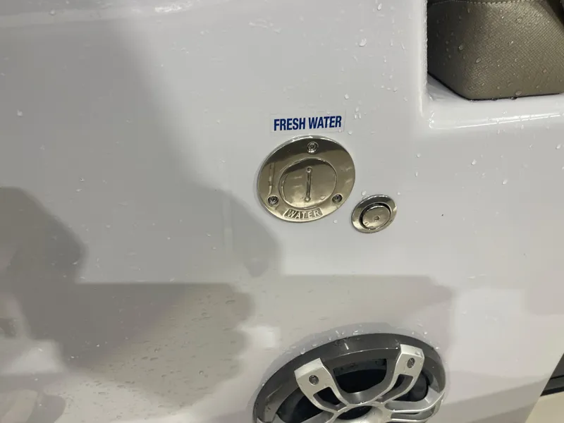 Slide: The Image of 2024 Key West 291FS boat fresh water access and speaker detail. - 45