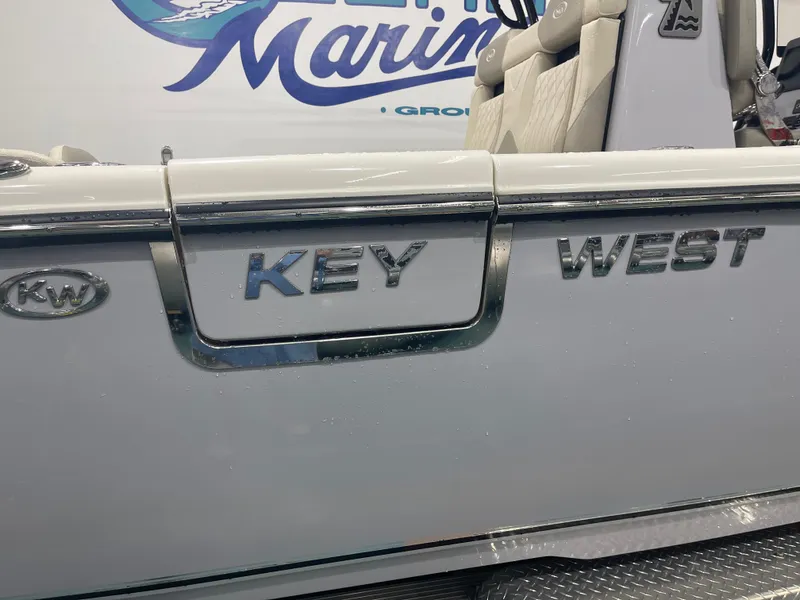 Slide: The Image of 2024 Key West 291FS boat with chrome logo detail. - 5