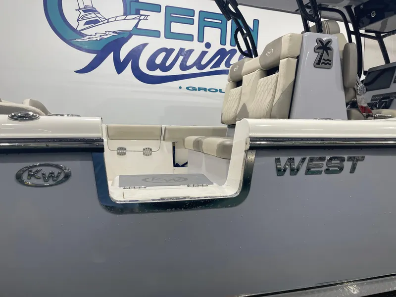 Slide: The Image of 2024 Key West 291FS boat interior with logo and seating detail. - 6