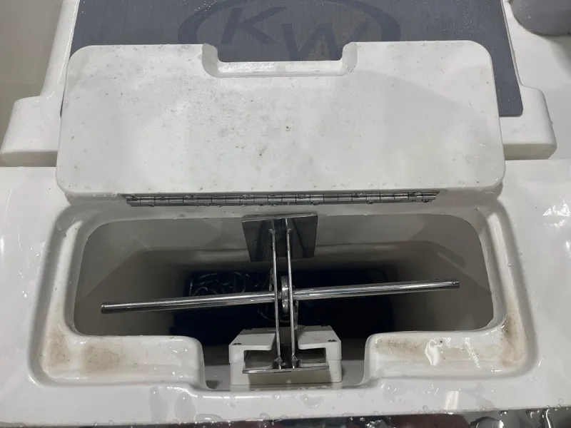 Slide: The Image of 2024 Key West 291FS boat anchor compartment with open lid. - 8