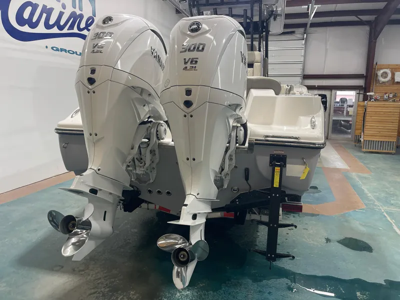 Slide: The Image of 2024 Key West 291FS boat with dual Yamaha 300 V6 engines in showroom. - 9
