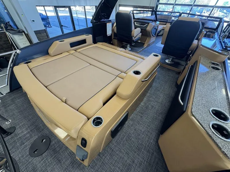 Slide: The Image of 2025 Godfrey AquaPatio 255 DFLW interior with tan seating and modern design. - 14