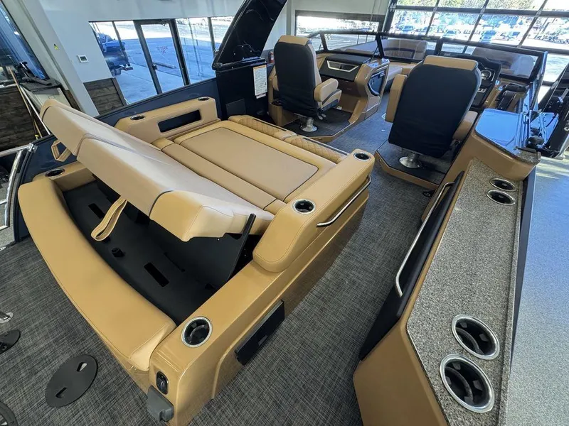 Slide: The Image of Luxurious interior of 2025 Godfrey AquaPatio 255 DFLW pontoon boat with tan seating. - 15
