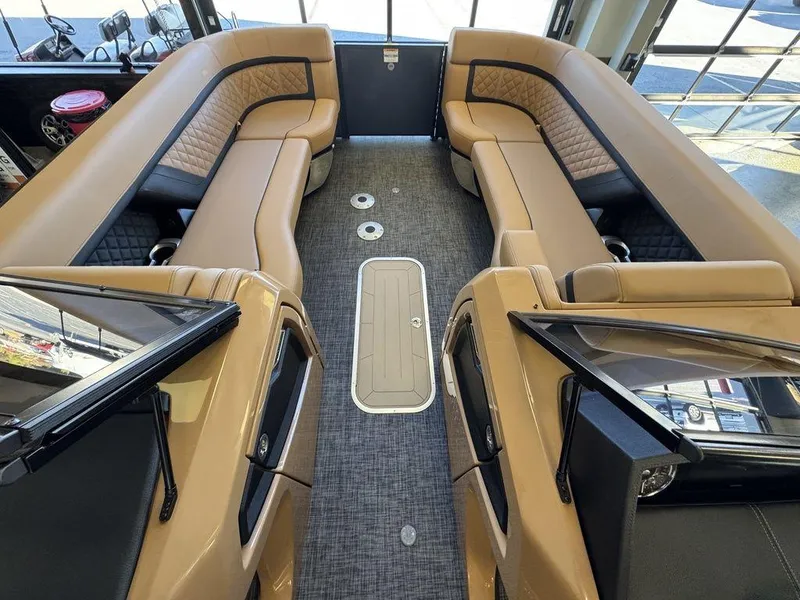Slide: The Image of Luxurious interior of 2025 Godfrey AquaPatio 255 DFLW pontoon boat with tan seating. - 21