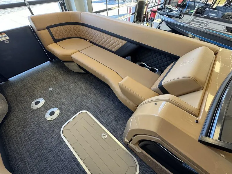 Slide: The Image of Luxurious seating on 2025 Godfrey AquaPatio 255 DFLW pontoon boat interior. - 24