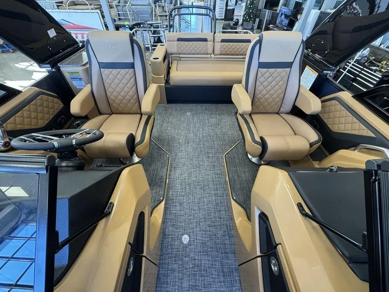 Slide: The Image of Luxurious interior of 2025 Godfrey AquaPatio 255 DFLW pontoon boat with plush seating. - 26