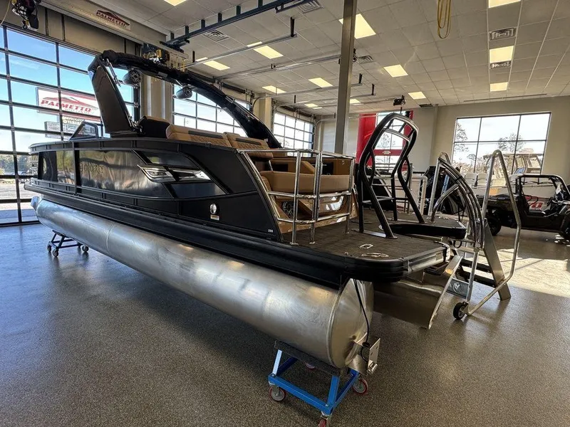Slide: The Image of 2025 Godfrey AquaPatio 255 DFLW pontoon boat displayed in a showroom. - 6