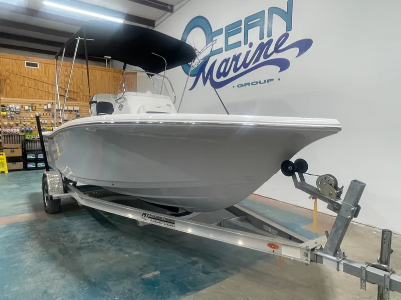 Slide: The Image of 2025 Tidewater 198CC boat on trailer at Ocean Marine showroom. - 11