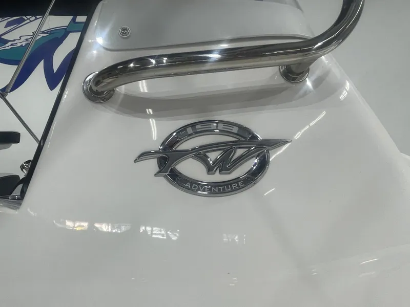 Slide: The Image of 2025 Tidewater 198CC boat with chrome logo and sleek design. - 13