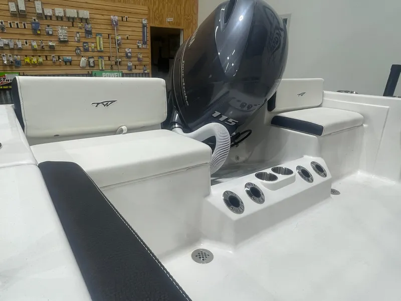 Slide: The Image of 2025 Tidewater 198CC boat interior with Yamaha 115 engine and seating area. - 14