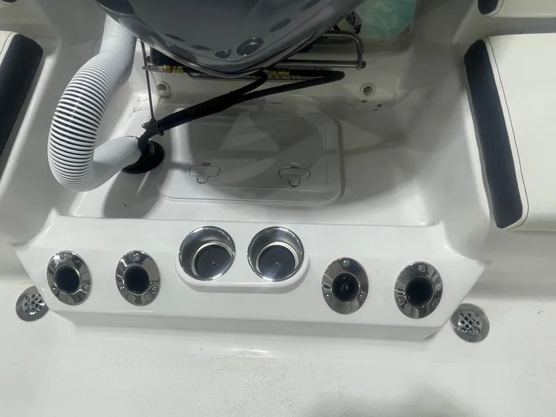 Slide: The Image of 2025 Tidewater 198CC boat dashboard with control panel and seating. - 19