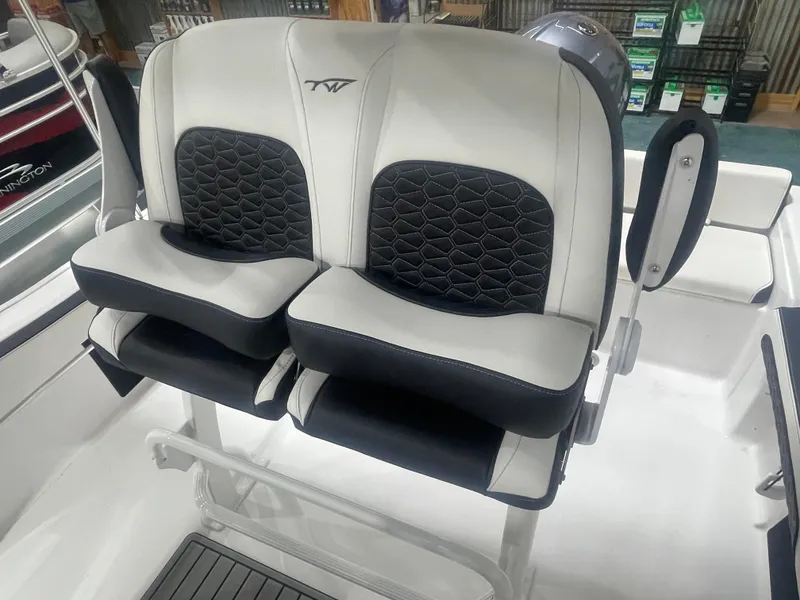 Slide: The Image of 2025 Tidewater 198CC boat seats with black and white upholstery, featuring a modern design. - 22