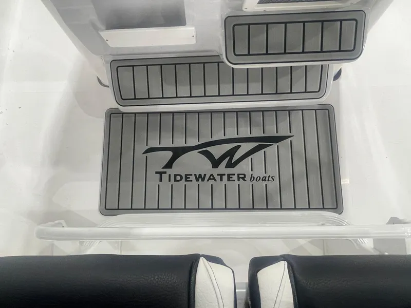 Slide: The Image of Tidewater 198CC 2025 boat interior with branded flooring and seating. - 23