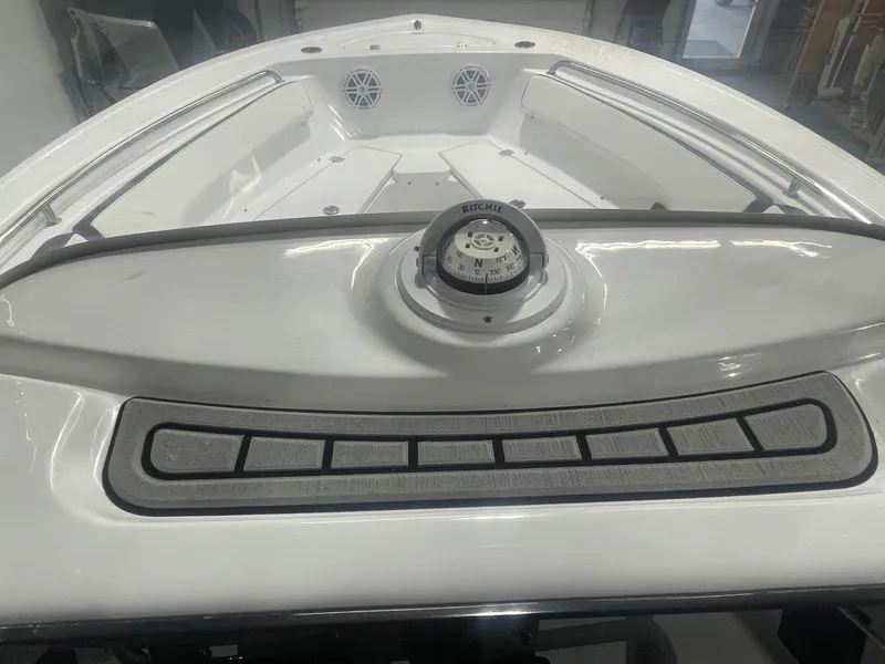 Slide: The Image of 2025 Tidewater 198CC boat interior with compass and seating area. - 29