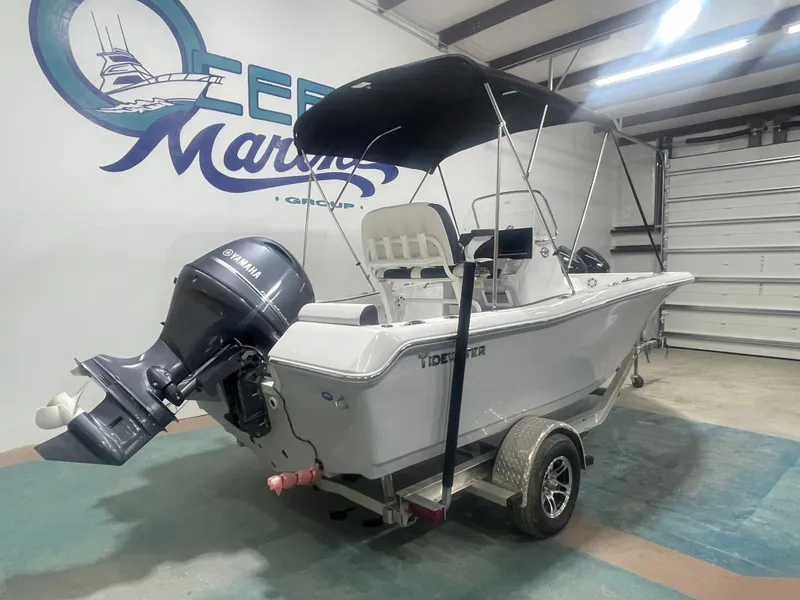 Slide: The Image of 2025 Tidewater 198CC boat with Yamaha outboard motor in a showroom. - 3