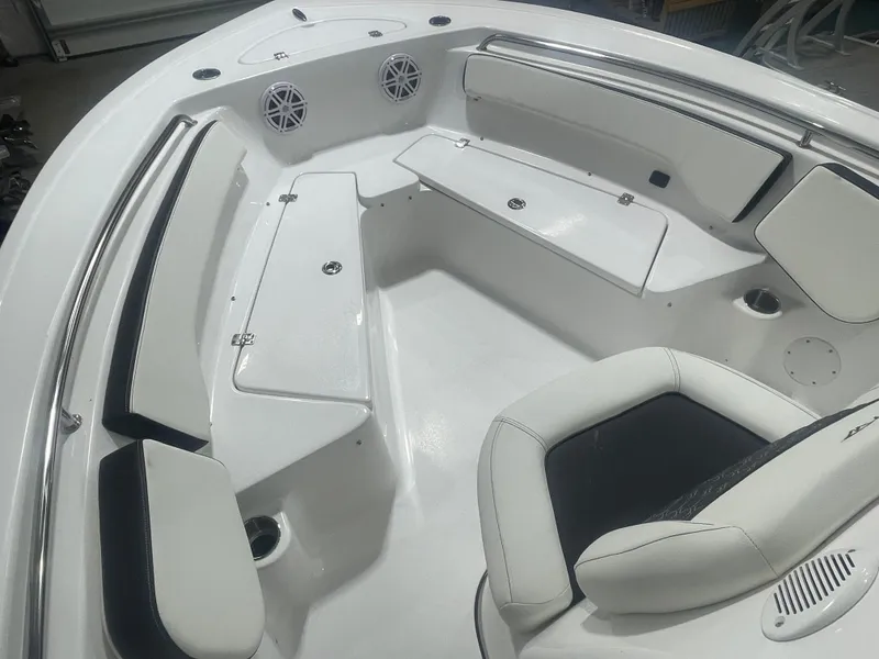 Slide: The Image of 2025 Tidewater 198CC boat interior with white seating and storage compartments. - 30