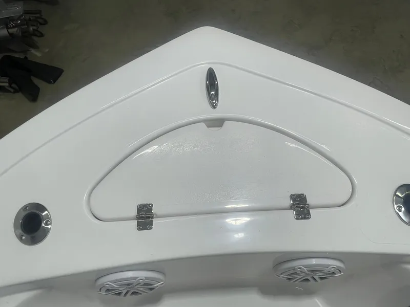 Slide: The Image of 2025 Tidewater 198CC boat bow with storage compartment and speakers. - 32