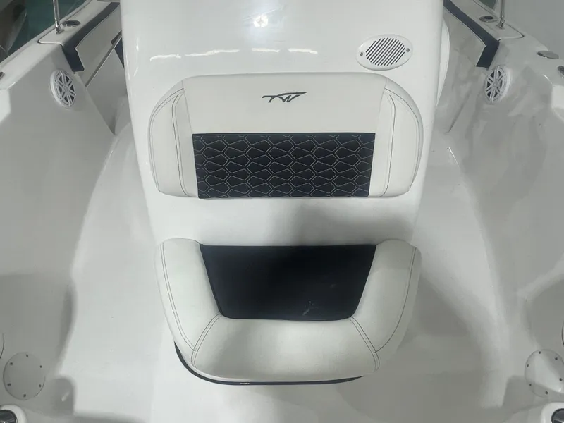 Slide: The Image of 2025 Tidewater 198CC boat seat with black and white upholstery design. - 34