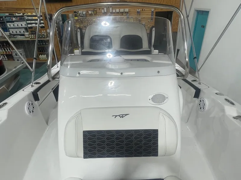 Slide: The Image of 2025 Tidewater 198CC boat interior with steering console and seating. - 35