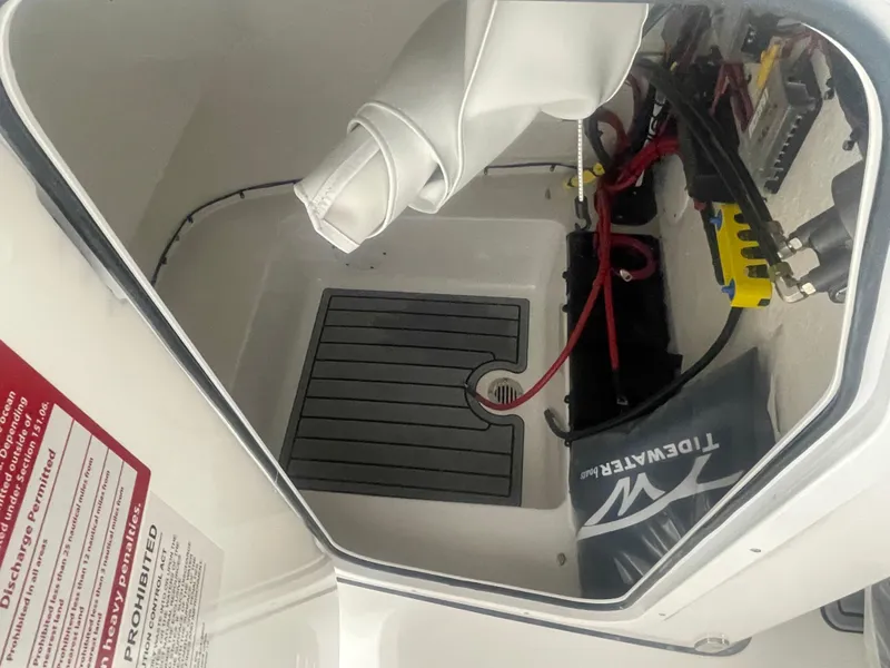 Slide: The Image of 2025 Tidewater 198CC boat storage compartment with wiring and equipment. - 37