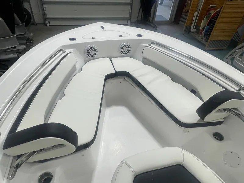 Slide: The Image of 2025 Tidewater 198CC boat interior with white cushioned seating and stainless steel railings. - 38
