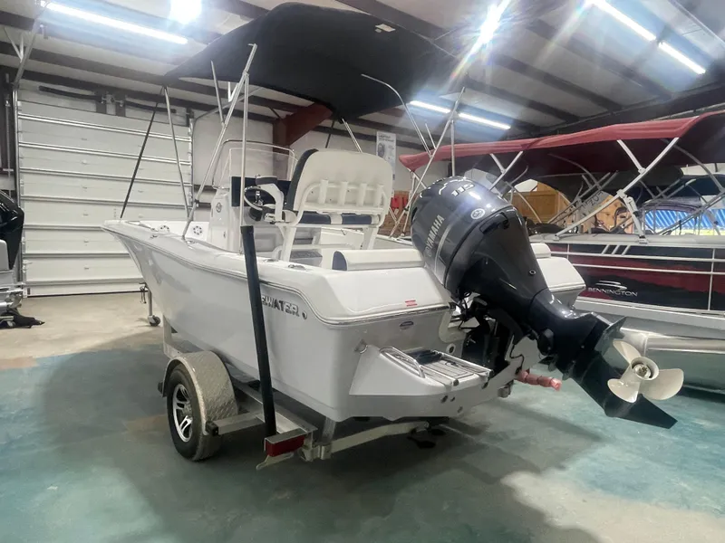 Slide: The Image of 2025 Tidewater 198CC boat with Yamaha outboard motor in a showroom. - 6