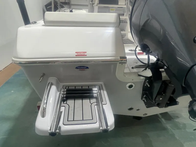 Slide: The Image of 2025 Tidewater 198CC boat with swim platform and outboard motor. - 7
